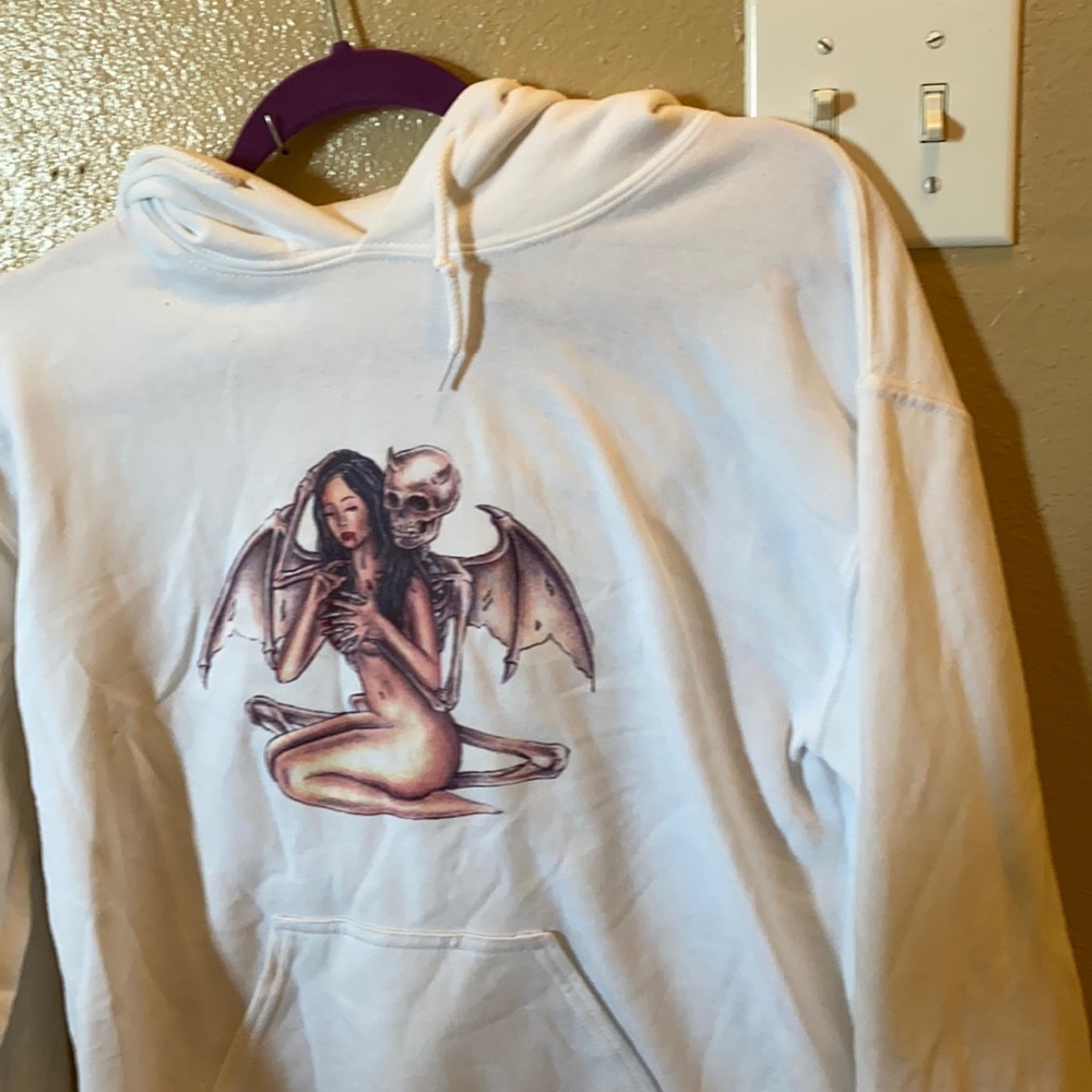 White Hoodie With Design On Front.